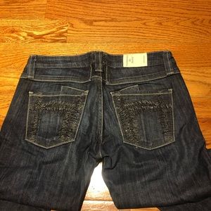 Dark wash skinny jeans by Taverniti So Denim